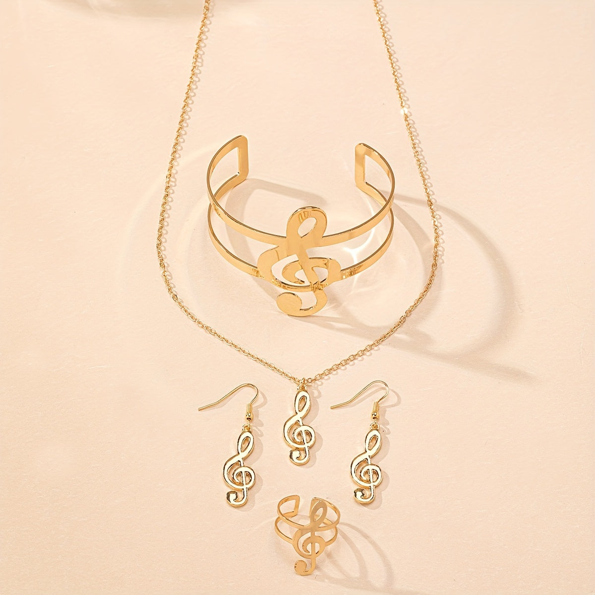 Elegant Music Note Jewelry Set: A Chic Necklace, Dangling Earrings, A Statement Bracelet, and a Ring, Perfect for Everyday Wear and Music Festivals